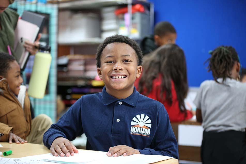 students and teacher working in classroom