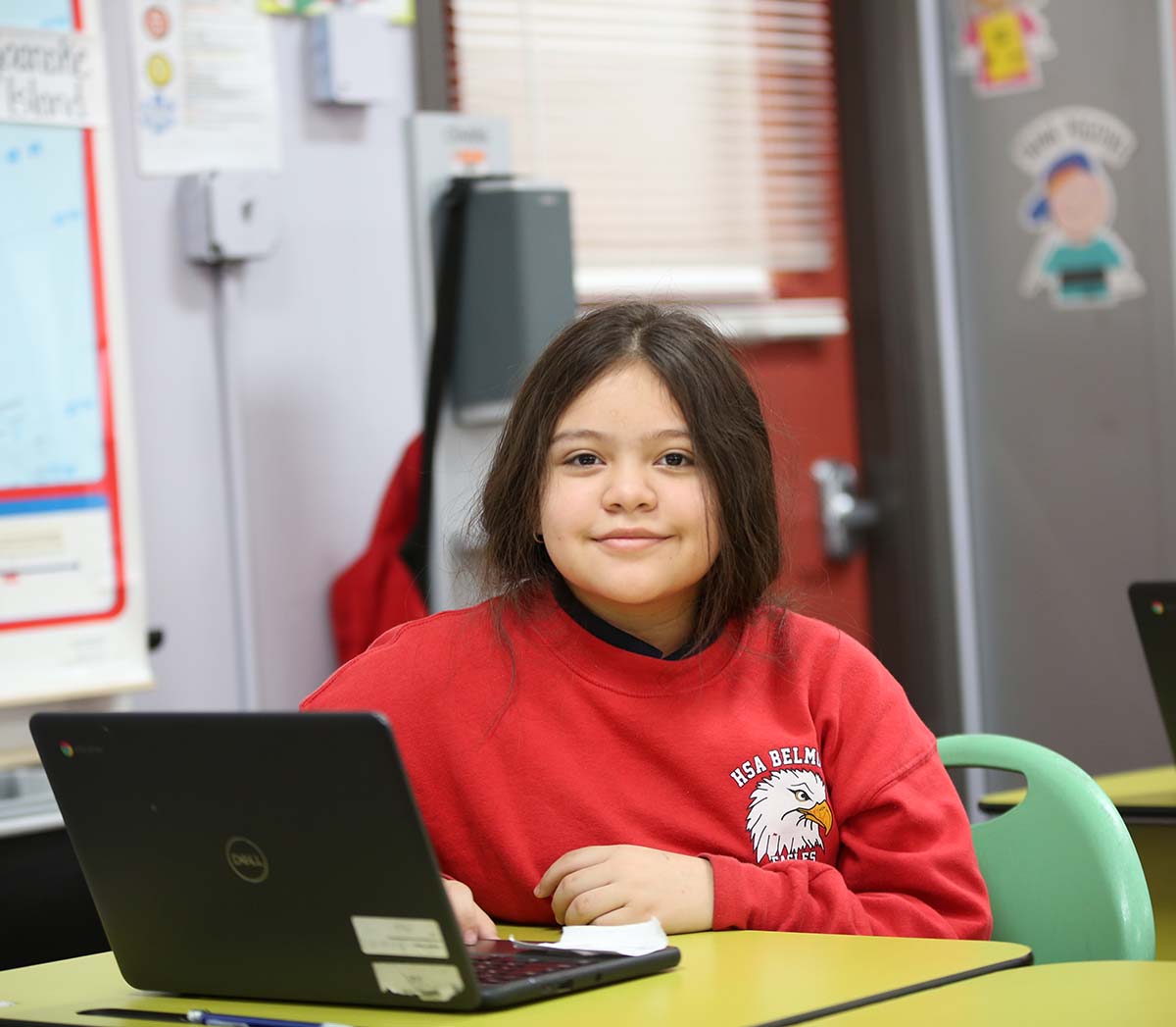 Smiling children together outdoors.